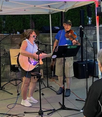 Fiddle and acoustic guitar unite at a recent open mic at Paradise Pub in Moon Township.