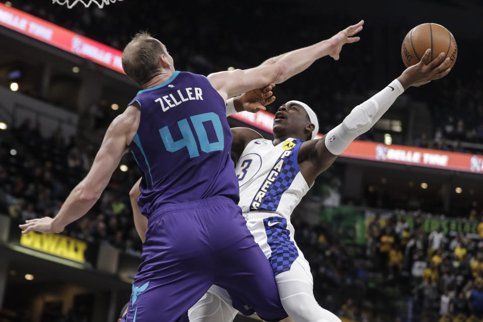 Indiana Pacers' Aaron Holiday (3) shoots against sCharlotte Hornets' Cody Zeller (40) during the second half of an NBA basketball game, Sunday, Dec. 15, 2019, in Indianapolis. (AP Photo/Darron Cummings)