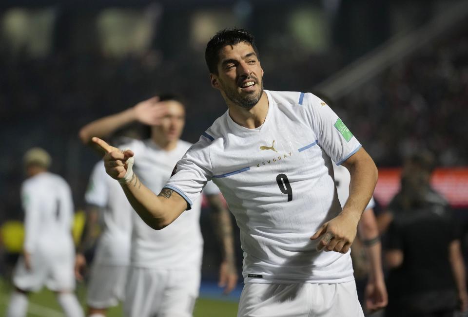FILE - Uruguay's Luis Suarez celebrates scoring his side's opening goal against Paraguay during a qualifying soccer match for the FIFA World Cup Qatar 2022 at General Pablo Rojas stadium in Asuncion, Paraguay, Thursday, Jan. 27, 2022. (AP Photo/Jorge Saenz, File)