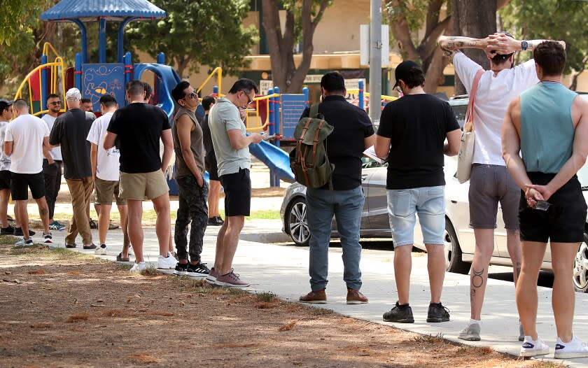 LOS ANGELES, CALIF. - JULY 21, 2022. People line up get vaccinated against the monkeypox virus on Thursday, July 21, 2022, at Eugene Obregon Park in Boyle Heights. (Luis Sinco / Los Angeles Times)