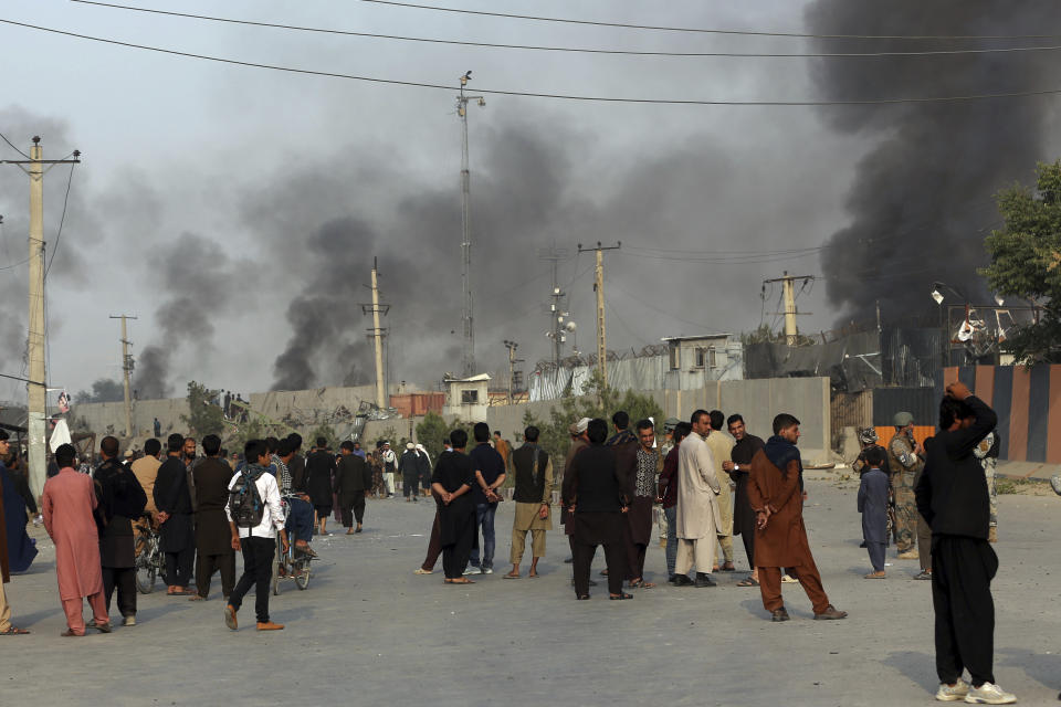 Smoke billows from the Green Village, home to several international organizations and guesthouses, in Kabul, Afghanistan, Tuesday, Sept. 3, 2019. Angry residents climbed into the international compound that had been targeted and set part of it on fire. (AP Photo/Rahmat Gul)