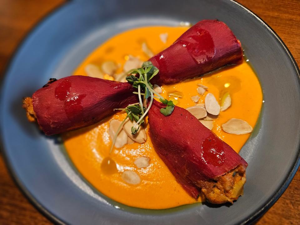 Piquillo rellenos, which translates to "stuffed piquillo peppers," at Beso restaurant in downtown Sarasota photographed Aug. 12, 2023.