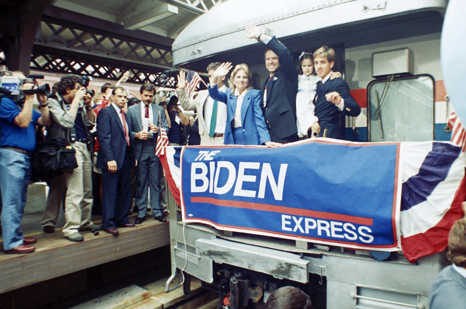 FILE - In this June 9, 1987, file photo Sen. Joe Biden, D-Del., waves from his train as he leaves Wilmington, Del., after announcing his candidacy for president. At right, son Beau carries daughter; to Biden's right is his wife Jill and son Hunt. Biden has won the last few delegates he needed to clinch the Democratic nomination for president. (AP Photo/George Widman, File)