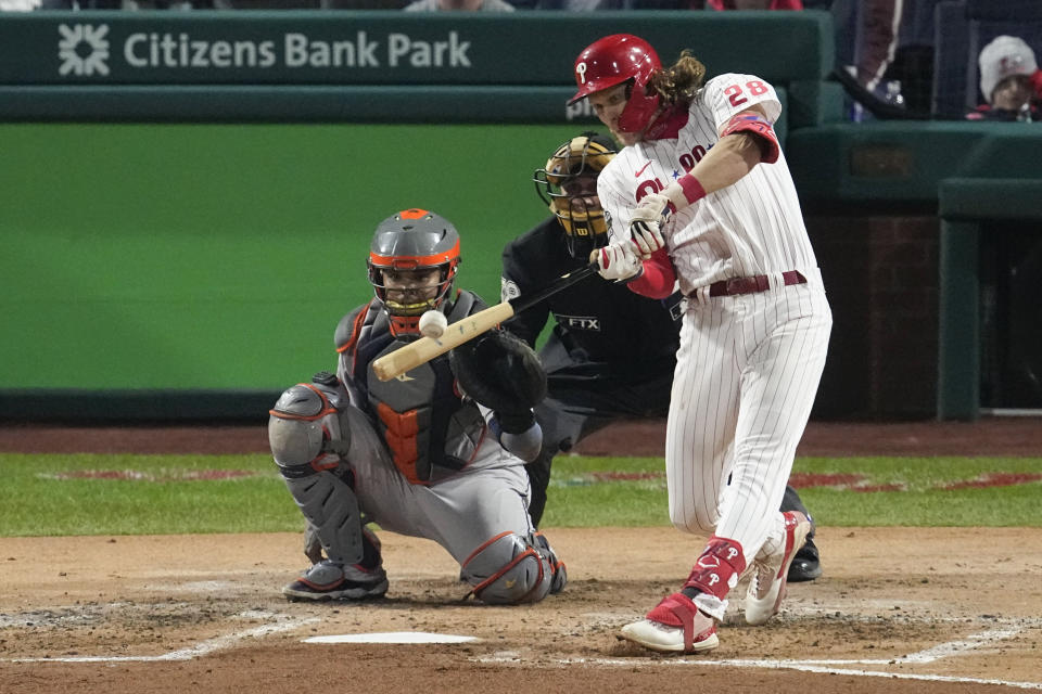 Philadelphia Phillies' Alec Bohm hits a home run during the second inning in Game 3 of baseball's World Series between the Houston Astros and the Philadelphia Phillies on Tuesday, Nov. 1, 2022, in Philadelphia. (AP Photo/Matt Rourke)