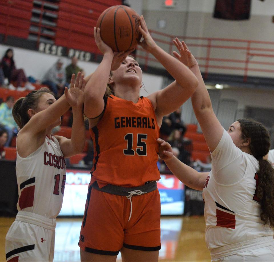 Ridgewood's Kelley Masloski goes up for a shot against Coshocton's Isabelle Lauvray (left) and Myrakle Johnson (right) in a regular season game. Masloski was named All-Ohio Special Mention in Division III.