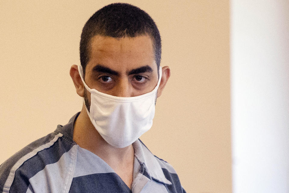 FILE — Hadi Matar, charged with stabbing author Salman Rushdie, listens during an arraignment in the Chautauqua County Courthouse in Mayville, NY., Aug. 18, 2022. Matar's lawyer is in talks with county and federal prosecutors to try to resolve existing charges of attempted murder without a trial — as well as potential terrorism-related charges that could still be coming, he said Friday, May 10, 2024. (AP Photo/Joshua Bessex, File)