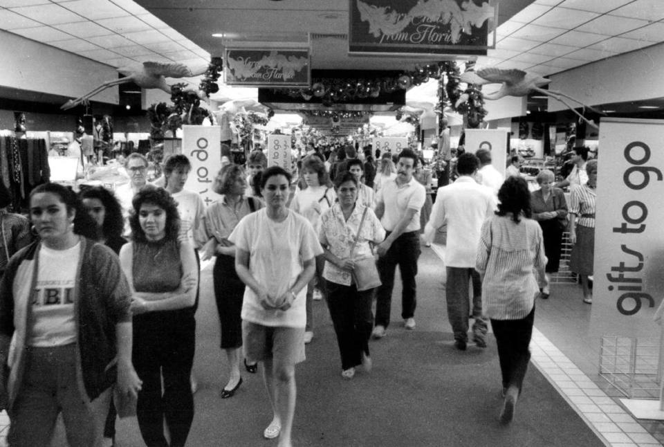 Christmas shoppers cruise through Burdines at Dadeland Mall on the day after Thanksgiving in 1988.
