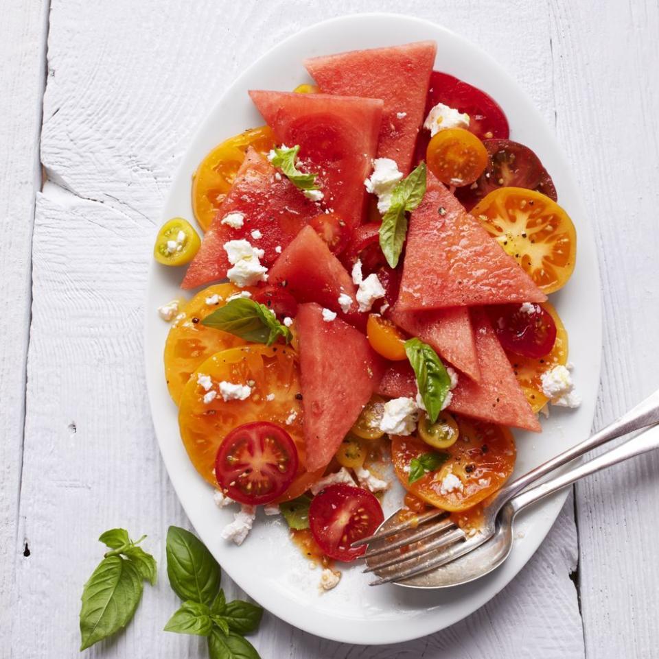 <p>Bring a little taste of summer home with you at any point in the year with this delicious salad. Paired with basil and feta, this salad makes for a standalone meal or side dish. </p><p><em><a href="https://www.womansday.com/food-recipes/a32934915/tomato-and-watermelon-salad-recipe/" rel="nofollow noopener" target="_blank" data-ylk="slk:Get the Tomato & Watermelon Salad recipe.;elm:context_link;itc:0;sec:content-canvas" class="link ">Get the Tomato & Watermelon Salad recipe.</a></em></p>