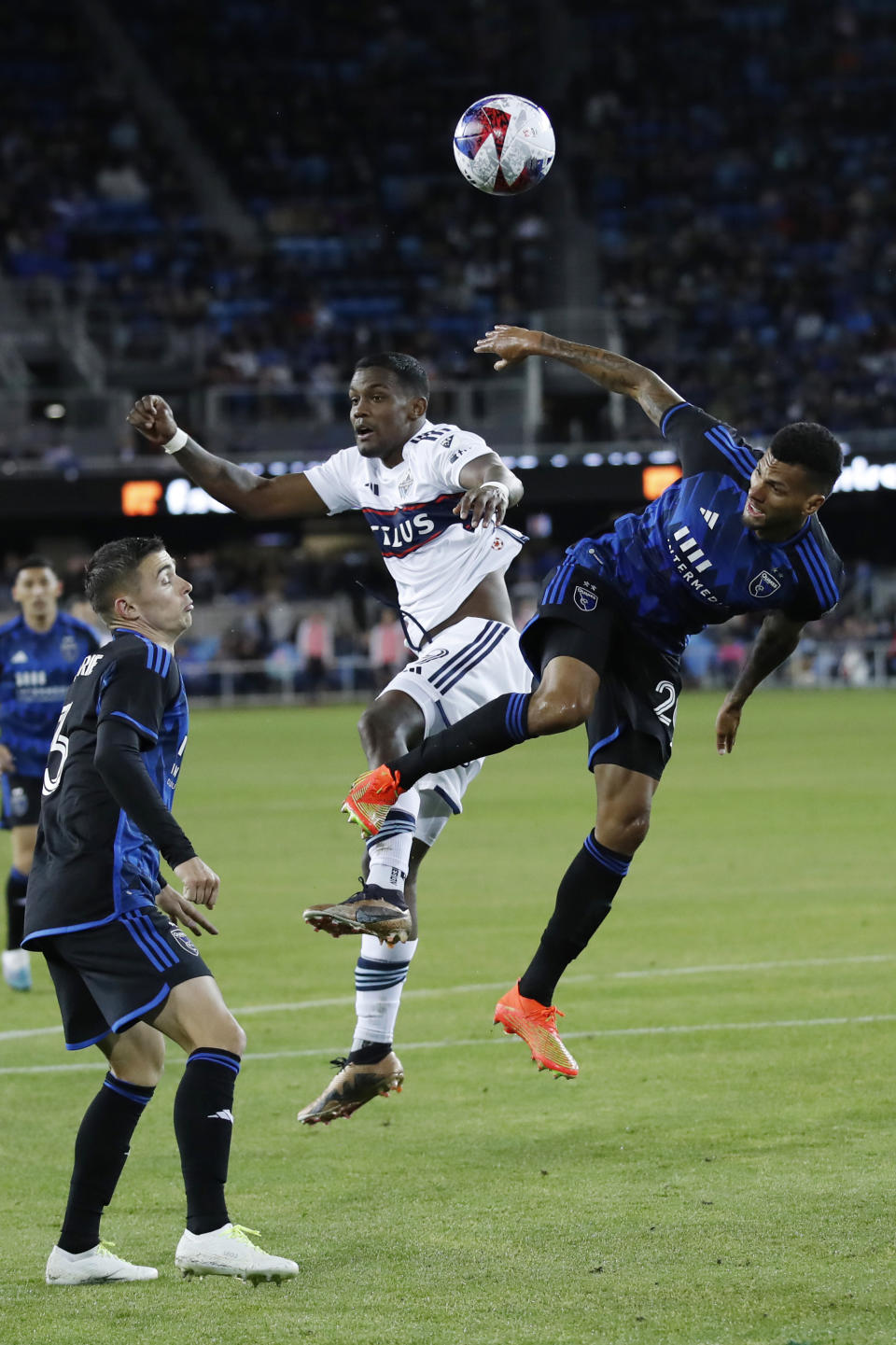 Vancouver Whitecaps forward Sergio Cordova (9) goes up for a header against San Jose Earthquakes defender Rodrigues, right, during the second half of an MLS soccer match in San Jose, Calif., Saturday, March 4, 2023. (AP Photo/Josie Lepe)