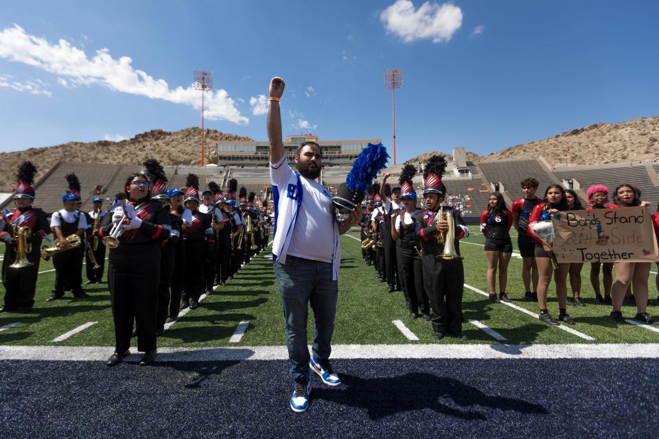 The Bowie marching band director Roberto Campos III joins the Bowie and Jefferson band playing the fight song for Daniel Esparza’s family during halftime of a football game on Saturday, Sept. 16, 2023, at the Sun Bowl. Esparza was the drum major of the Bowie band. He passed on Sunday.