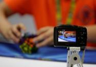 A competitor solves a Rubik's cube during the Rubik's Cube European Championship in Prague, Czech Republic, July 15, 2016. Picture taken July 15, 2016. REUTERS/David W Cerny