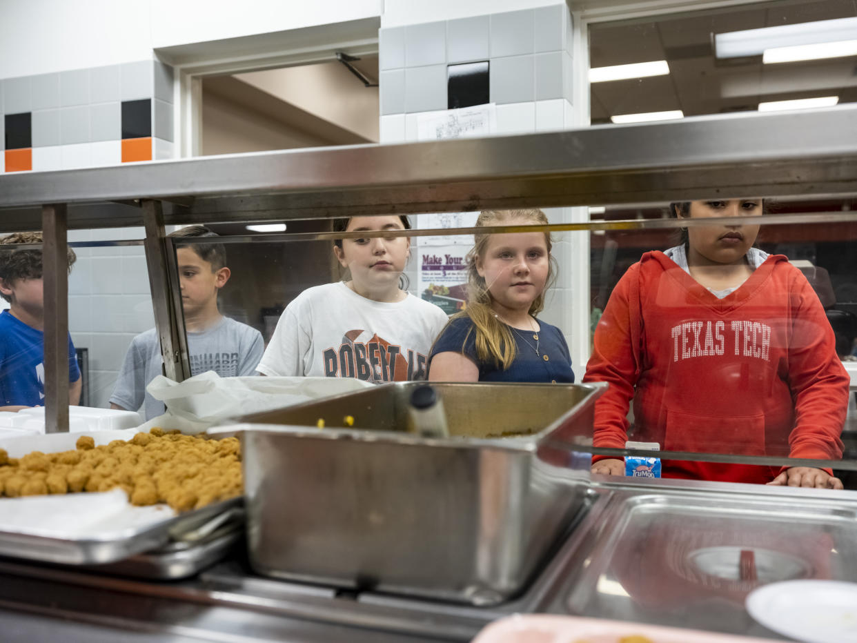 Students line up to receive their lunch at Robert Lee ISD in Robert Lee, Texas on March 9, 2023. (Matthew Busch for NBC News)