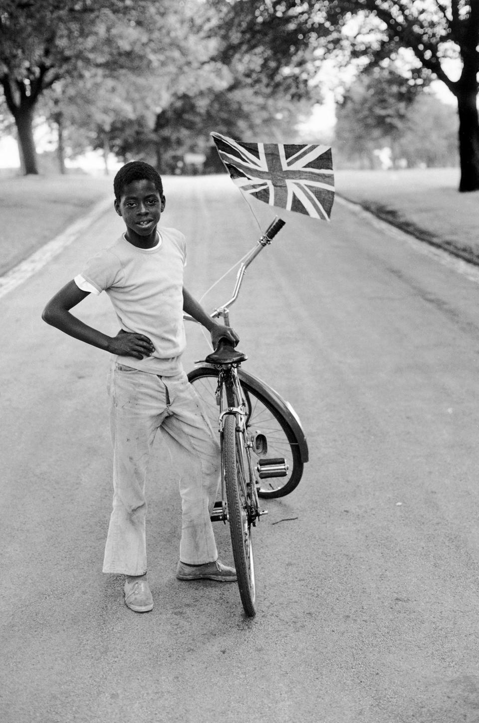 Boy with flag, Wilfred in Handsworth Park, photograph, by Vanley Burke, 1970, England (© Vanley Burke)