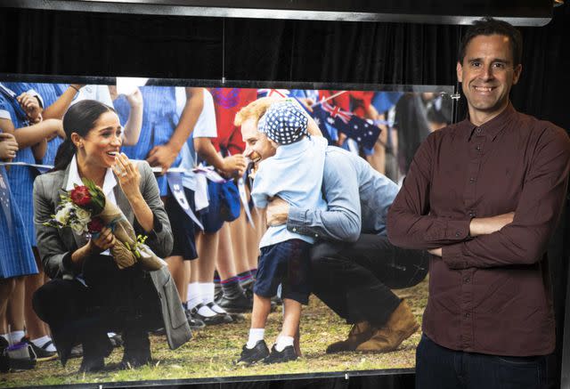 <p>John Nguyen/PA Media Assignments</p> Zak Hussein with his photo of Prince Harry and Meghan at the launch of Princess Diana: Accredited Access Exhibition in London on May 23, 2024