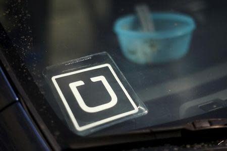 An Uber car is seen parked with the driver's lunch left on the dashboard in Venice, Los Angeles, California, United States July 15, 2015. REUTERS/Lucy Nicholson