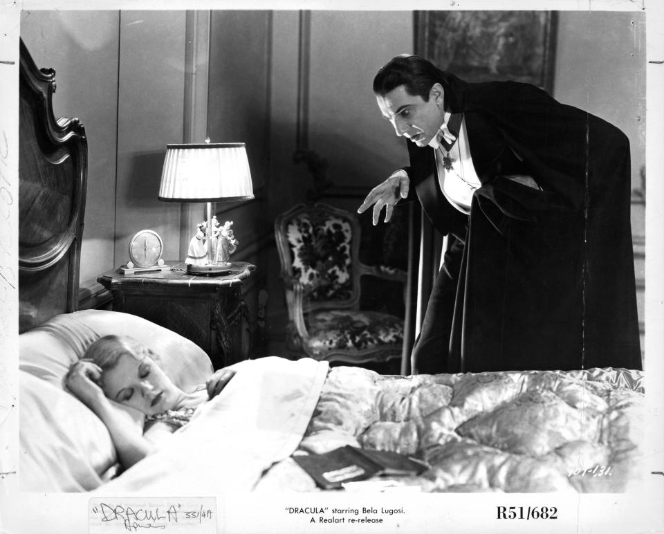 Bela Lugosi stalks a woman sleeping in a scene from the film 'Dracula', 1931. (Photo by Universal/Getty Images)