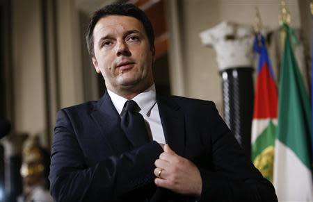 Italy's newly elected Prime Minister Matteo Renzi arrives for a news conference following a meeting with Italian president Giorgio Napolitano, in which he has unveiled the names of the members of his government, at the Qurinale presidential palace in Rome February 21, 2014. REUTERS/Tony Gentile