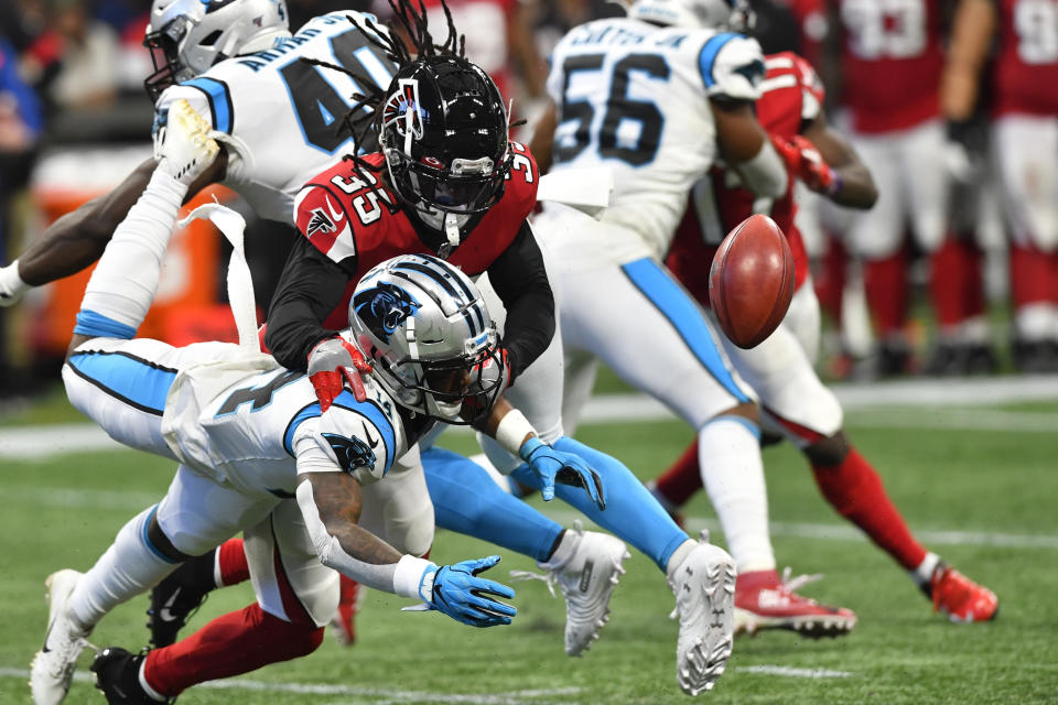 Carolina Panthers wide receiver Greg Dortch (14) misses the ball against Atlanta Falcons defensive back Kemal Ishmael (36) during the second half of an NFL football game, Sunday, Dec. 8, 2019, in Atlanta. (AP Photo/John Amis)