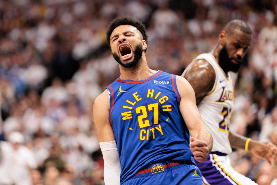 Apr 20, 2024; Denver, Colorado, USA; Denver Nuggets guard Jamal Murray (27) reacts to dunking the ball during the first quarter against the Los Angeles Lakers in game one of the first round for the 2024 NBA playoffs at Ball Arena. Mandatory Credit: Andrew Wevers-USA TODAY Sports