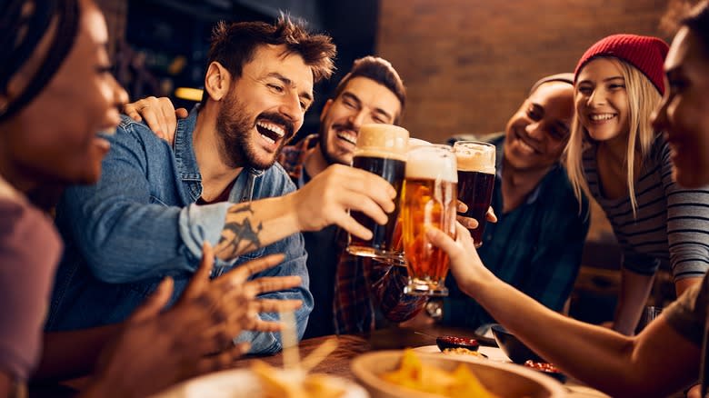 Friends toasting with beer