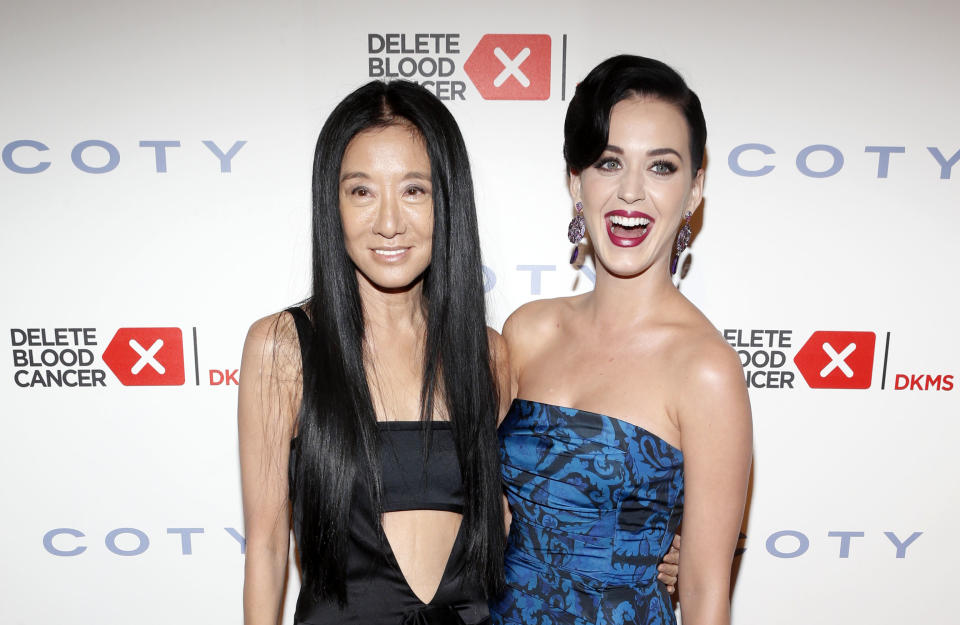 FILE - This May 1, 2013 photo originally released by Coty shows singer Katy Perry, right, and fashion designer Vera Wang at the seventh annual Delete Blood Cancer Gala in New York. Wang, 63, was honored for her lifetime achievement by the Council of Fashion Designers at its star-studded awards show Monday night. She received the award from her former employer and mentor Ralph Lauren, and she received a standing ovation from her peers. (AP Photo/Coty, Jason Decrow, file)