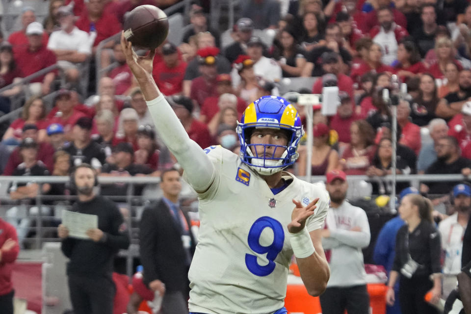 Los Angeles Rams quarterback Matthew Stafford (9) throws against the Arizona Cardinals during the second half of an NFL football game, Sunday, Sept. 25, 2022, in Glendale, Ariz. (AP Photo/Rick Scuteri)