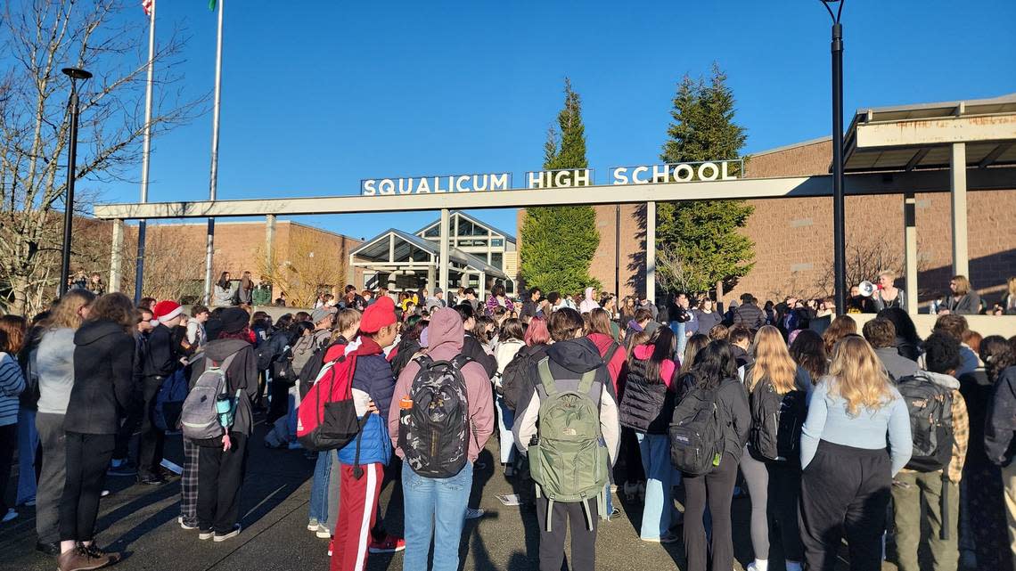 Students listen to speakers after walking out of classes Monday morning, Dec. 12, at Squalicum High School in Bellingham. Students spoke about their experiences with sexual assaults and what they said is a lack of care and accountability from administrators. Three Bellingham Public Schools assistant principals were issued criminal citations Wednesday, Dec. 7, for failure to report, a gross misdemeanor.