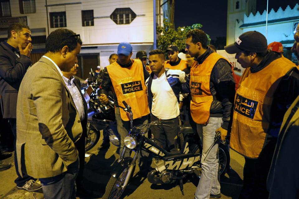 This Saturday April 26, 2014 photo shows Moroccan police officers detaining a suspect after his arrest in Casablanca, Morocco. As home to most of Morocco’s economy, as well as most its slums, Casablanca in particular has always had a crime problem. It is a city of extremes, with skyscrapers and highend nightlife on one hand and the other the crushing poverty that spawned the angry youth who killed 33 people in a spate of bombings in 2003.(AP Photo / Abdeljalil Bounhar)