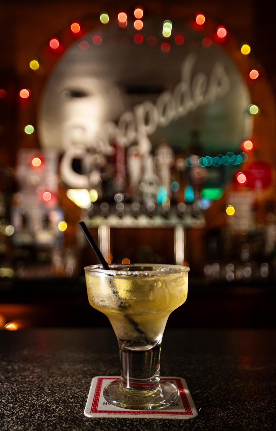 Escapades' signature Golden Margarita is also known as "a regular on the rocks" by longtime customers of the bar on University Avenue.