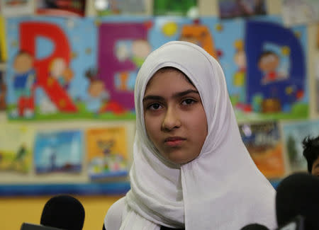 Khawlah Noman, 11, speaks to reporters at Pauline Johnson Junior Public School, after she told police that a man cut her hijab with scissors in Toronto, Ontario, Canada January 12, 2018. REUTERS/Chris Helgren