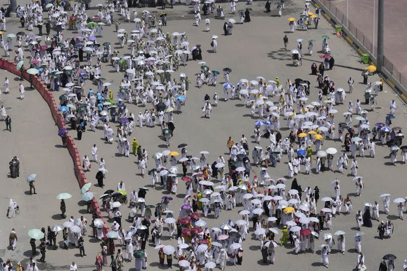 Muslim pilgrims arrive to cast stones at pillars in the symbolic stoning of the devil, the last rite of the annual hajj, in Mina, Saudi Arabia, Sunday, June 16, 2024.