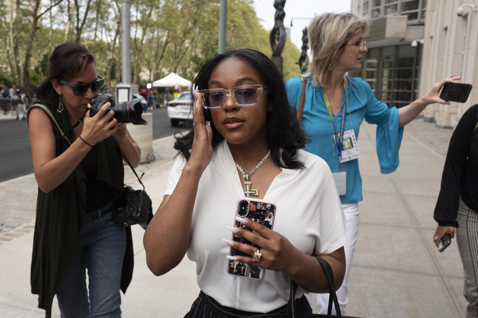 Azriel Clary, a woman who lived in Chicago with R&B singer R. Kelly, leaves Brooklyn federal court following his arraignment, Friday, Aug. 2, 2019 in New York. Kelly faces charges he sexually abused women and girls. (AP Photo/Mark Lennihan)