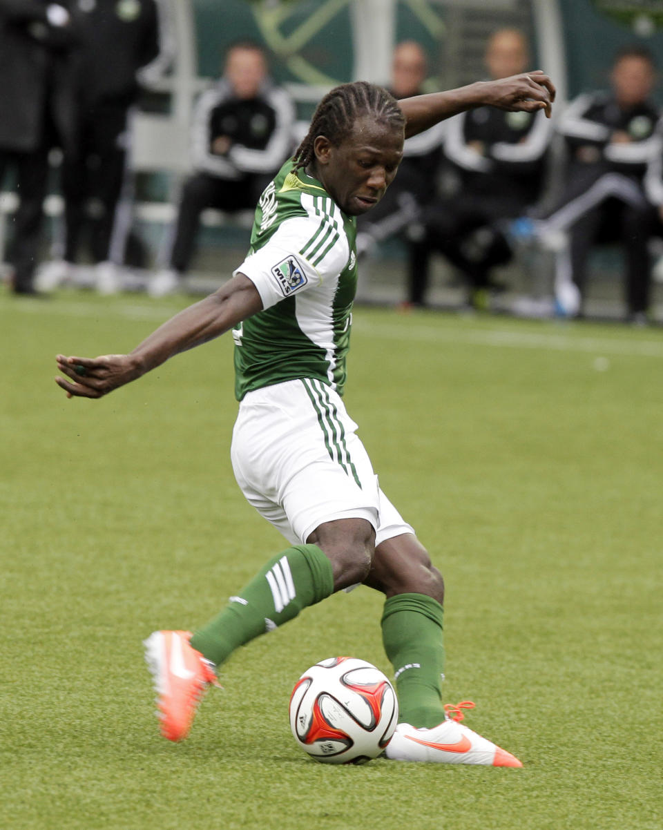 Portland Timbers midfielder Diego Chara shoots for a goal during the second half of an MLS soccer game against the Seattle Sounders in Portland, Ore., Saturday, April 5, 2014. Chara scored two goals as the teams tied 4-4. (AP Photo/Don Ryan)