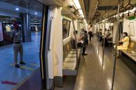 Commuters sit in a carriage of a Yellow Line train after Delhi Metro Rail Corporation (DMRC) resumed services in New Delhi on September 7, 2020.(Photo by PRAKASH SINGH/AFP via Getty Images)