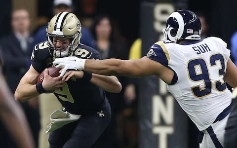 New Orleans Saints quarterback Drew Brees (9) is sacked by Los Angeles Rams nose tackle Ndamukong Suh (93) during the second quarter the NFC Championship game at Mercedes-Benz Superdome - Credit: USA TODAY