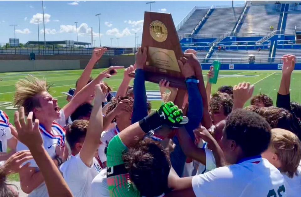 The Frisco Lone Star boys soccer team hoists the championship trophy after defeating El Paso Bel Air 4-1 in the Class 5A state title game on Saturday, April 15, 2023 at Birkelbach Field in Georgetown, Texas.