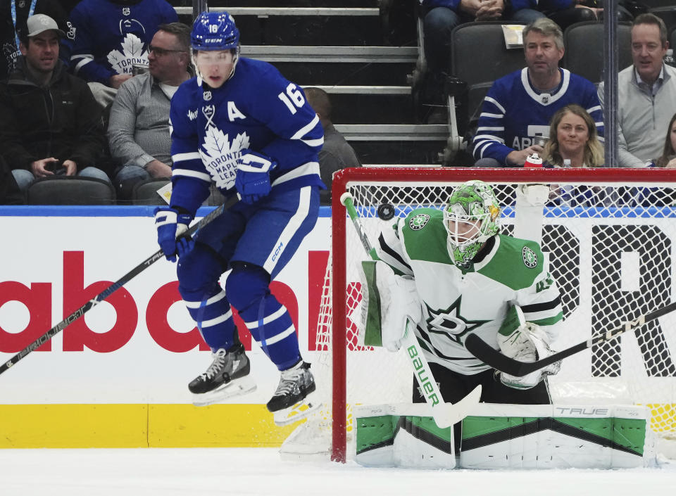 Dallas Stars goaltender Scott Wedgewood (41) is scored on as Toronto Maple Leafs forward Mitchell Marner (16) jumps out of the way of the shot during the first period of an NHL hockey game Wednesday, Feb. 7, 2024, in Toronto. (Nathan Denette/The Canadian Press via AP)