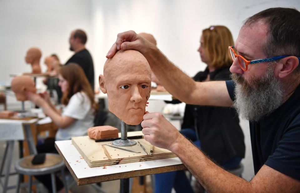 Aaron Board works on his sculpture during the Forensic Skull Sculpture Workshop at Ringling College of Art and Design. Board is a faculty member at Ringling and teaches anatomy and perspective drawing classes.
