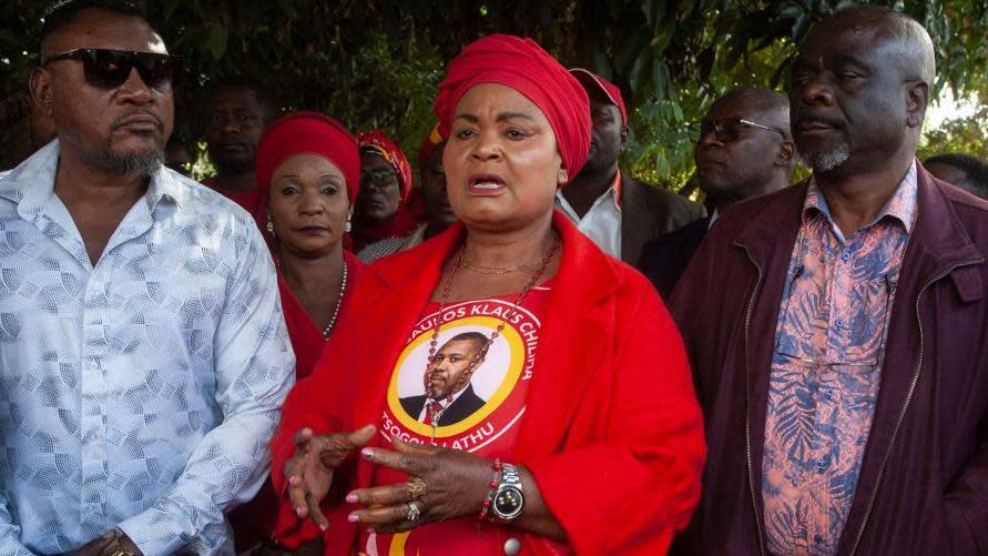 Secretary General for Malawi's Vice President Saulos Klaus Chilima's UTM party, Patricia Kaliati (C), addresses supporters and sympathizers soon after a press briefing following a press briefing in Lilongwe, on June 11, 2024