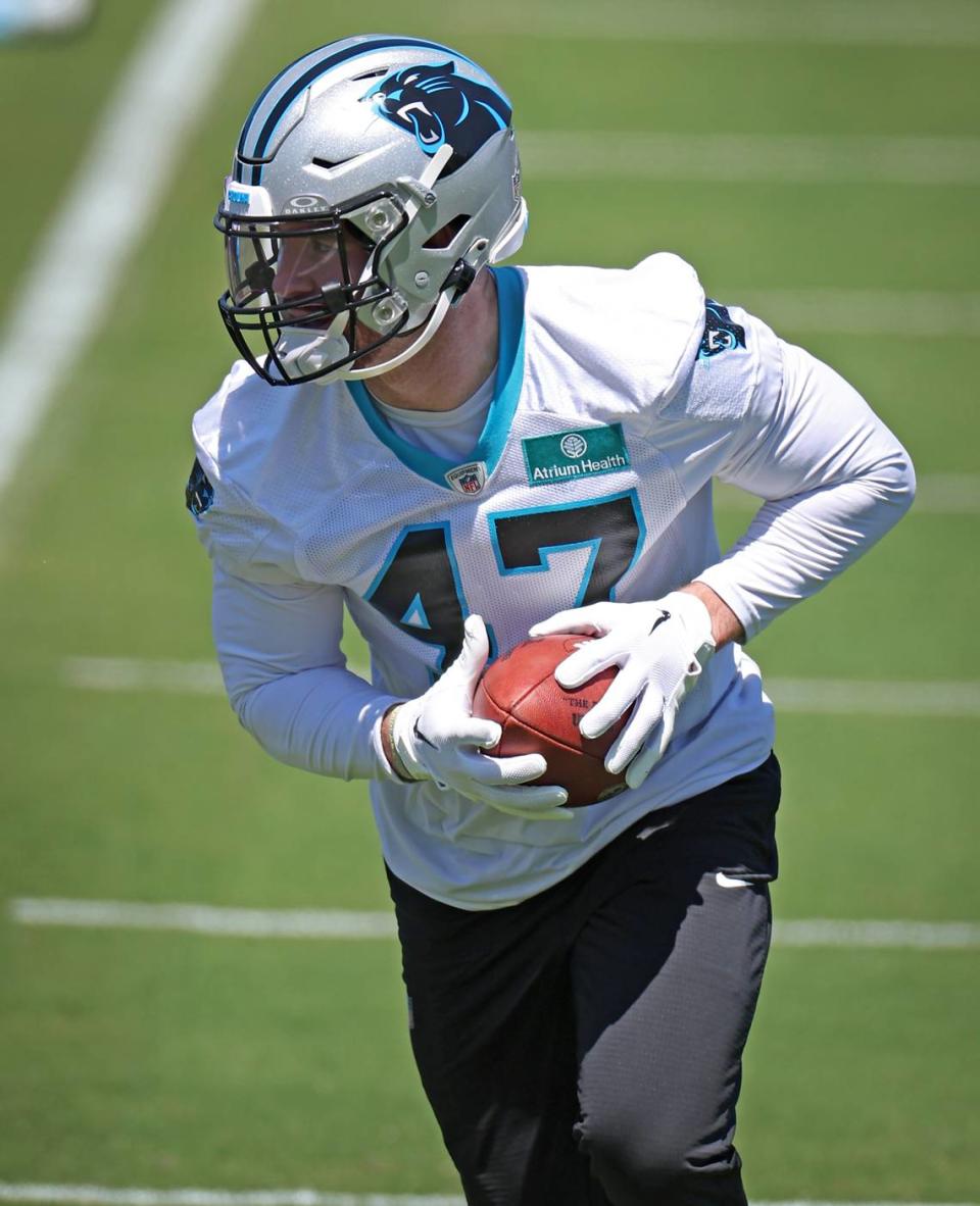 Carolina Panthers linebacker Josey Jewell picks up a ball during drills at the team’s voluntary minicamp practice on Tuesday, April 23, 2024.