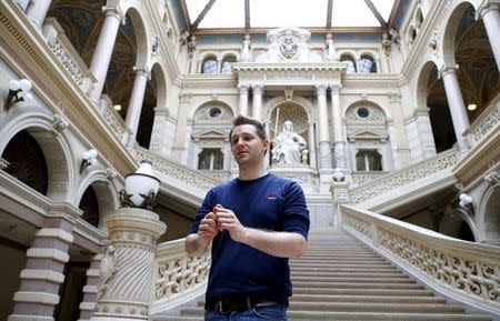 Austrian data activist Max Schrems stands in the courthouse after his trial against Facebook in Vienna April 9, 2015. REUTERS/Leonhard Foeger