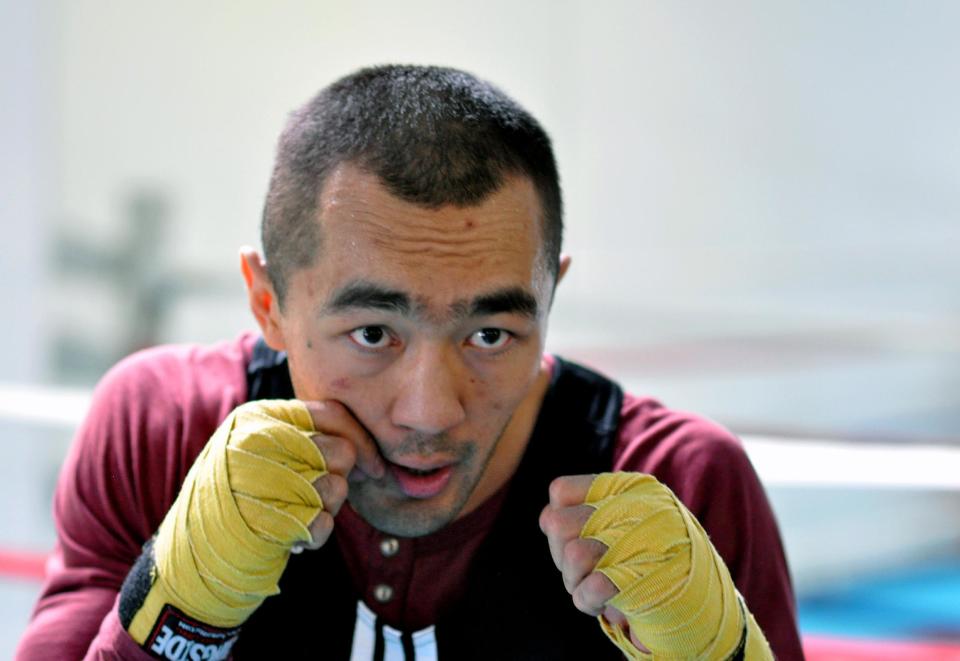 In this photo taken April 5, 2014, WBA and IBA light heavyweight boxing champion Beibut Shumenov, of Kazakhstan, poses in Las Vegas. Shumenov and IBF light heavyweight champion Bernard Hopkins will fight at the DC Armory on Saturday, April 19. (AP Photo/Joe Coomber)