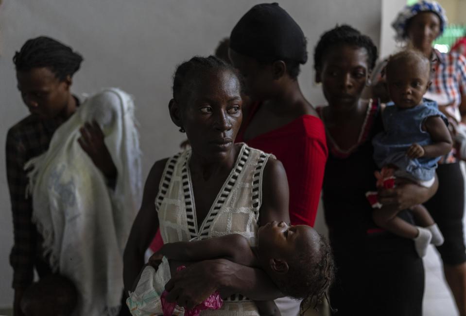 Women and malnourished children wait their turn to be weighed by health personnel at La Paix University Hospital, in Port-au-Prince, Haiti, Wednesday, May 8, 2024. (AP Photo/Ramon Espinosa)