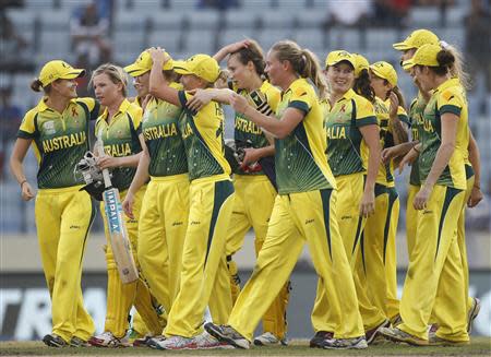 Australia's players celebrate as they win the ICC Twenty20 Women's World Cup title at the Sher-E-Bangla National Cricket Stadium in Dhaka April 6, 2014. REUTERS/Andrew Biraj