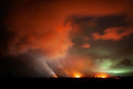 Three lava fissures erupt during an ongoing volcano outbreak at the Lanipuna Gardens subdivision in Pahoa, Hawaii, U.S., May 15, 2018. Courtesy John Linzmeier/U.S. Air National Guard/Handout via REUTERS