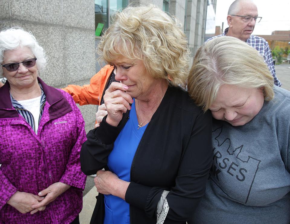 Sharla Rohrbaugh, widow of veteran John Eick, becomes emotional while talking about her husband. She is comforted by her daughter, Vonda Smith, right, and sister-in-law, Cheryl Eick.