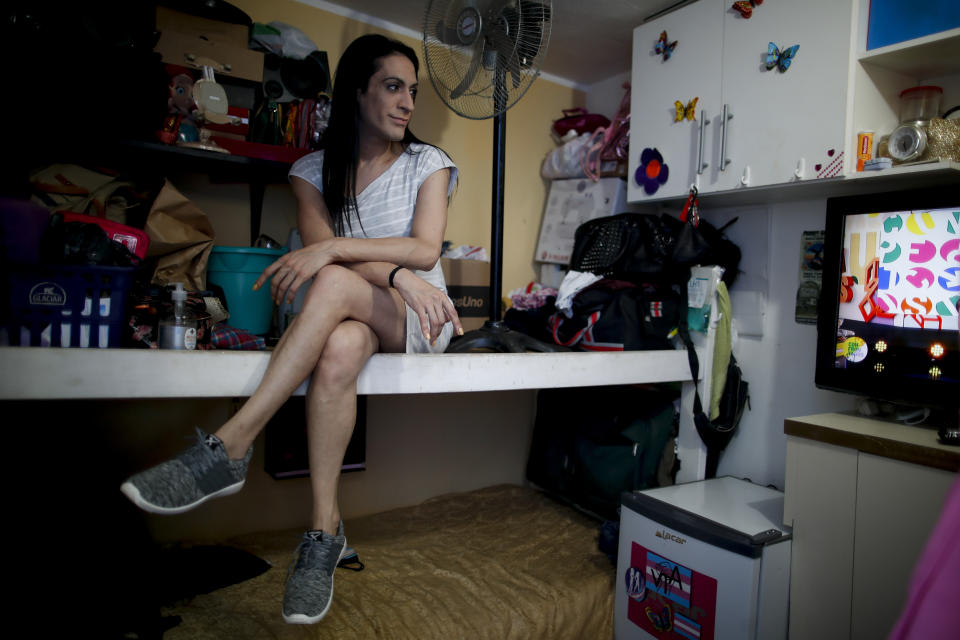 Transgender woman Gualdalupe Olivares poses for a photo in her room in Buenos Aires, Argentina, Monday, Nov. 16, 2020. “I think almost 100% of us have never had a formal job. You don't know what a paycheck is or social security benefits. It's a totally new world, ”said Olivares, after President Alberto Fernández signed a decree establishing a 1% employment quota for transgender people in the public sector. (AP Photo/Natacha Pisarenko)