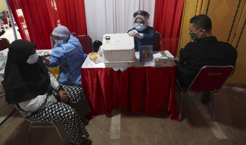 The AstraZeneca vaccine is administered during a vaccination campaign in Bekasi on the outskirts of Jakarta, Indonesia, Thursday, June 17, 2021. (AP Photo/Achmad Ibrahim)