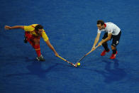 LONDON, ENGLAND - AUGUST 07: Nicholas Caitlin of Great Britain and Ramon Allegre of Spain challenge for the ball during the Men's Hockey match between Great Britain and Spain on Day 11 of the London 2012 Olympic Games at Riverbank Arena Hockey Centre on August 7, 2012 in London, England. (Photo by Daniel Berehulak/Getty Images)