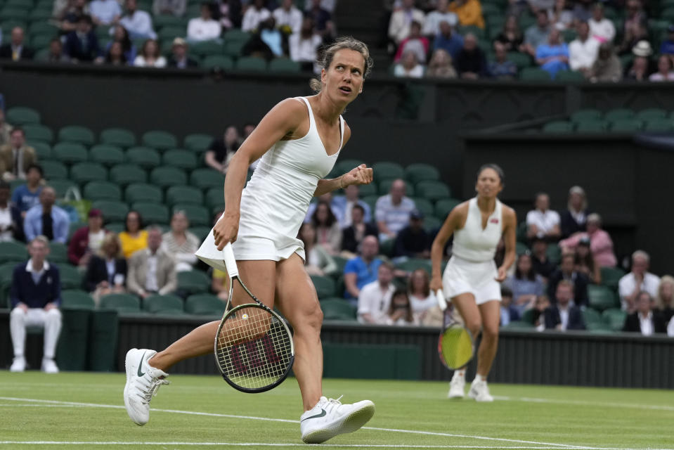 Barbora Strycova of the Czech Republic, left, and Taiwan's Hsieh Su-Wei react after winning a point against Australia's Storm Hunter and Belgium's Elise Mertens in the final of the women's doubles on day fourteen of the Wimbledon tennis championships in London, Sunday, July 16, 2023. (AP Photo/Kirsty Wigglesworth)